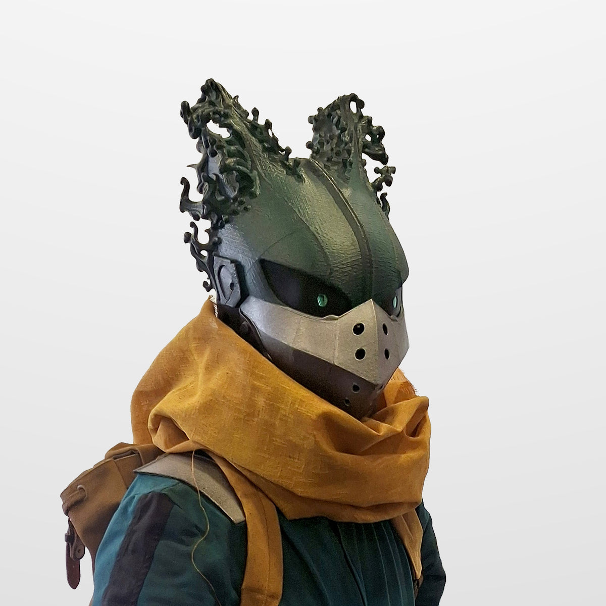 Dark Deku helmet worn with a mustard scarf, three-quarter view