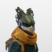 Dark Deku helmet worn with a mustard scarf, three-quarter view