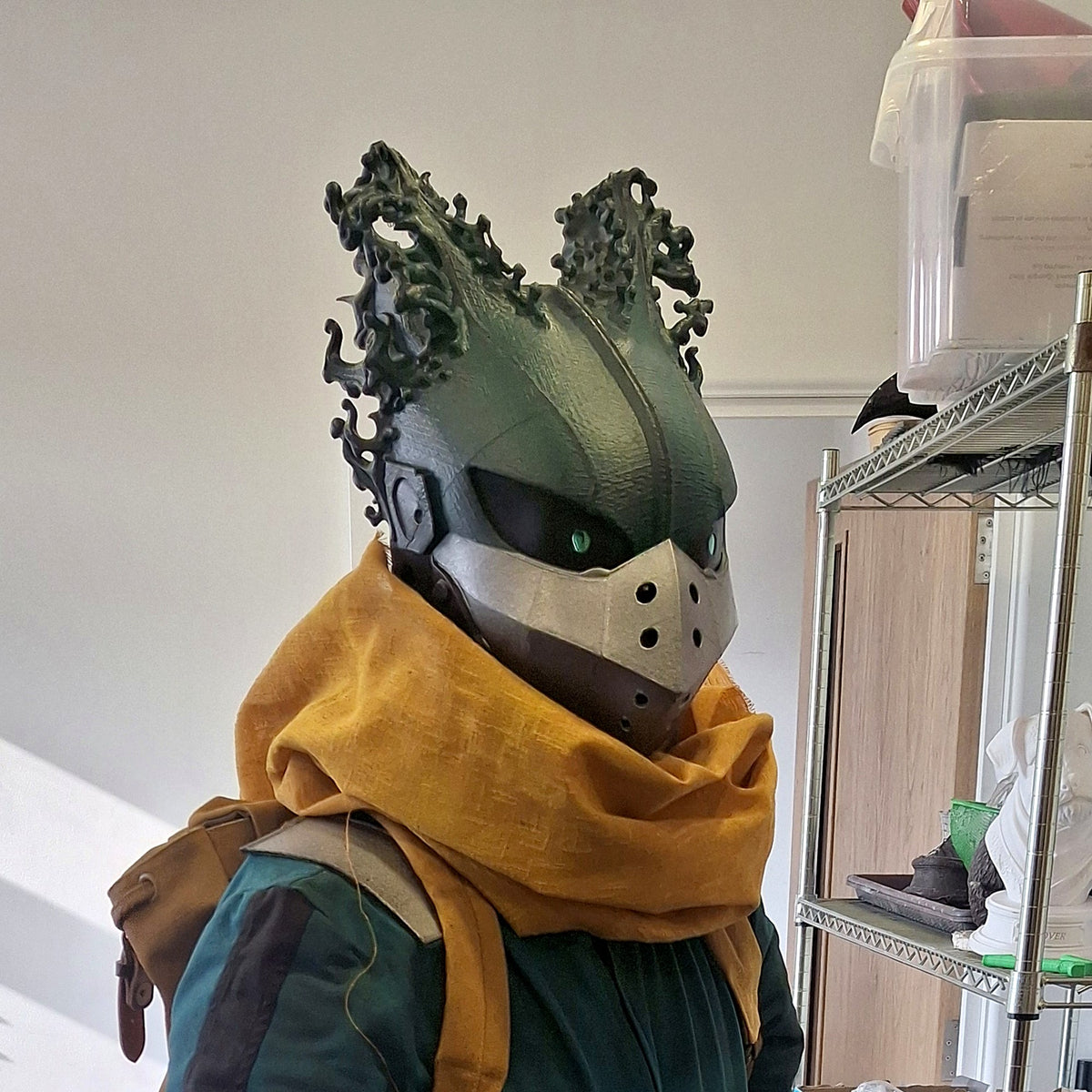 Dark Deku helmet worn with a mustard scarf, original photo